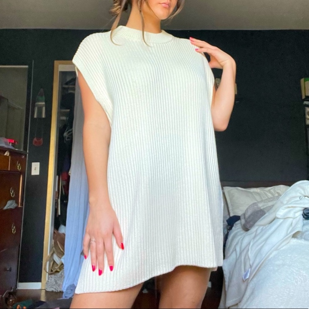 Cream sweater dress. Paired well with a belt and booties.